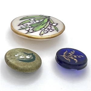 Three lily of the valley buttons.
