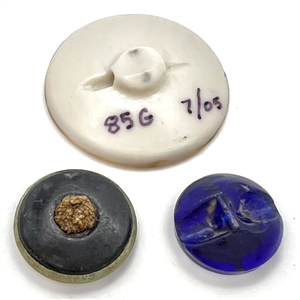 Three lily of the valley buttons.