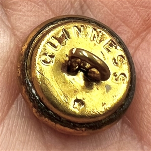 Original set of British Guinness buttons with store card.