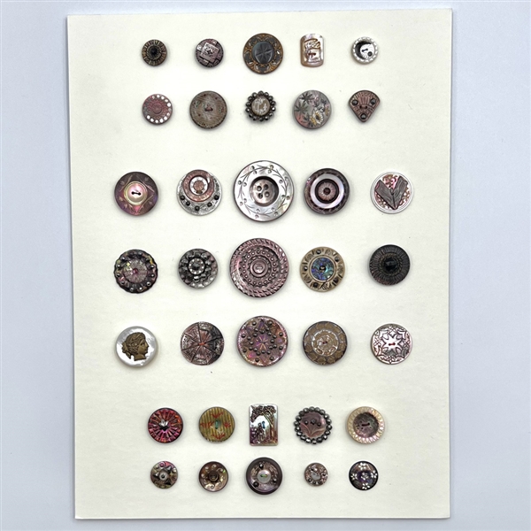 Card of 35 pearl and shell buttons including OMEs and DFs. 