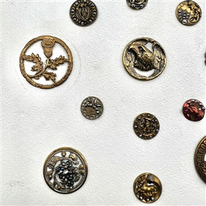 Card of 20 brass buttons of assorted subjects.