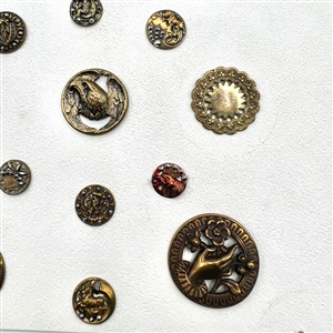 Card of 20 brass buttons of assorted subjects.