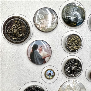 Card of 25 assorted buttons of people etc.