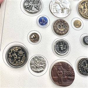 Card of 25 assorted buttons of people etc.