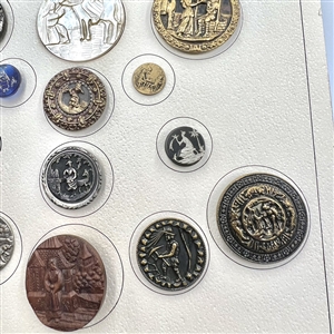 Card of 25 assorted buttons of people etc.