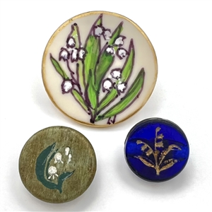 Three lily of the valley buttons.