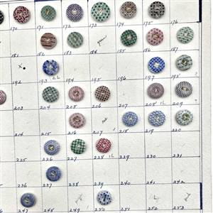 Card of 60 numbered china calico buttons.