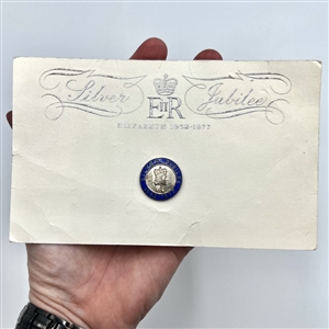 Silver Jubilee button for Queen Elizabeth II on original commemorative card. 