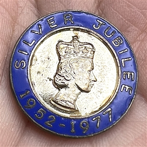 Silver Jubilee button for Queen Elizabeth II on original commemorative card. 