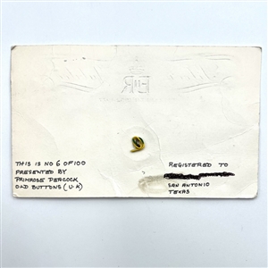 Silver Jubilee button for Queen Elizabeth II on original commemorative card. 