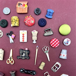 Card of 51 (mostly) sewing themed buttons .