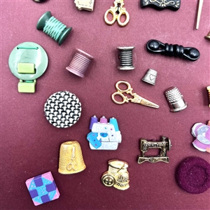 Card of 51 (mostly) sewing themed buttons .