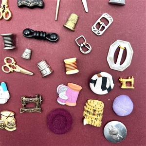 Card of 51 (mostly) sewing themed buttons .