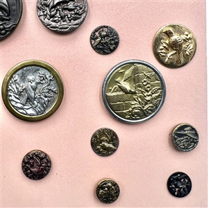 Card of 28 buttons depicting birds.