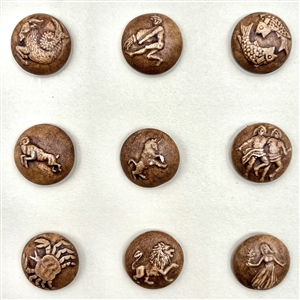 Card of 12 ceramic zodiac buttons. 