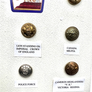 Card of 13 uniform buttons from England and Canada.