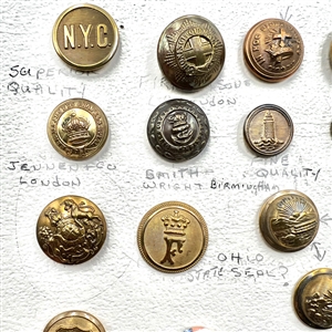 Card of 21 mostly uniform buttons.