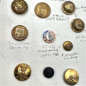 Card of 21 mostly uniform buttons.
