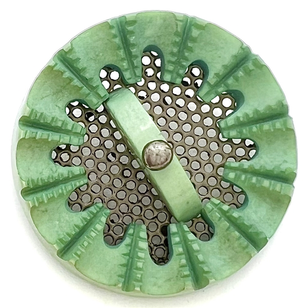 Screen back sculptural casein button with pin shank.