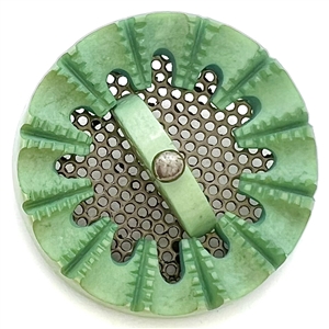 Screen back sculptural casein button with pin shank.