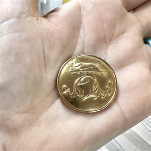Livery crest button of a hare with helm or rank and mantle.