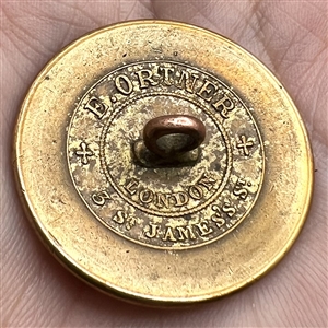 Livery crest button of a hare with helm or rank and mantle.