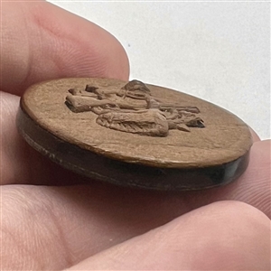Pressed horn sporting button of hunting objects.