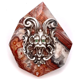 Cast silver Greenman with green paste eyes on leopardskin jasper button. 