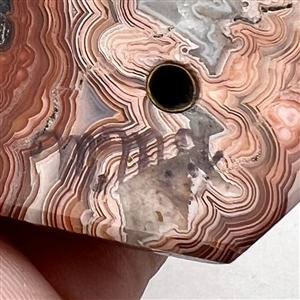 Cast silver Greenman with green paste eyes on leopardskin jasper button. 