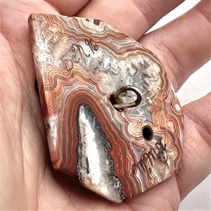 Cast silver Greenman with green paste eyes on leopardskin jasper button. 