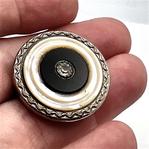 Sporting target button with four materials.
