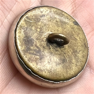 Sporting target button with four materials.