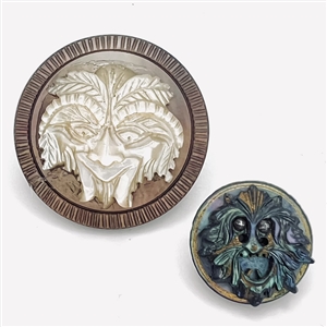 Two Greenman buttons of carved united pearl. 