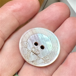 Incised and inked pearl Irish Claddagh button.