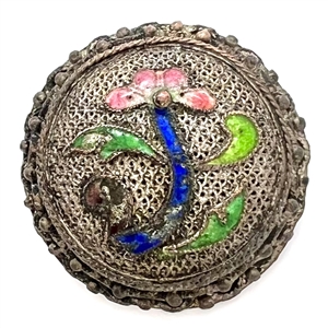 Silvered copper Asian button of an enameled flower.