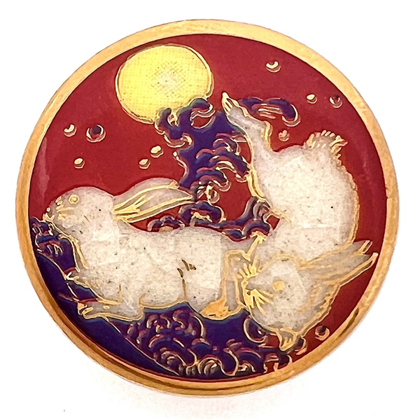 Modern Satsuma button of two rabbits under a full moon.