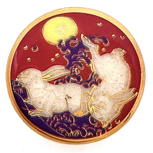 Modern Satsuma button of two rabbits under a full moon.