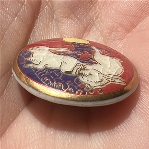 Modern Satsuma button of two rabbits under a full moon.