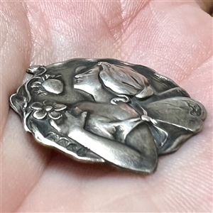 Art Nouveau Hallmarked silver button of a fairy with a strawberry. 
