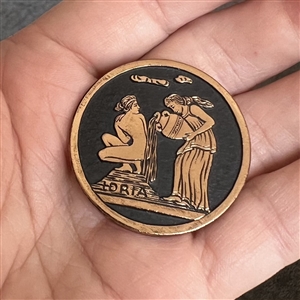 Greek Mythological aluminum button of Queen Nymph Eidyia being bathed.