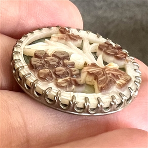 A 19th c. Carved pearl button of grapes.