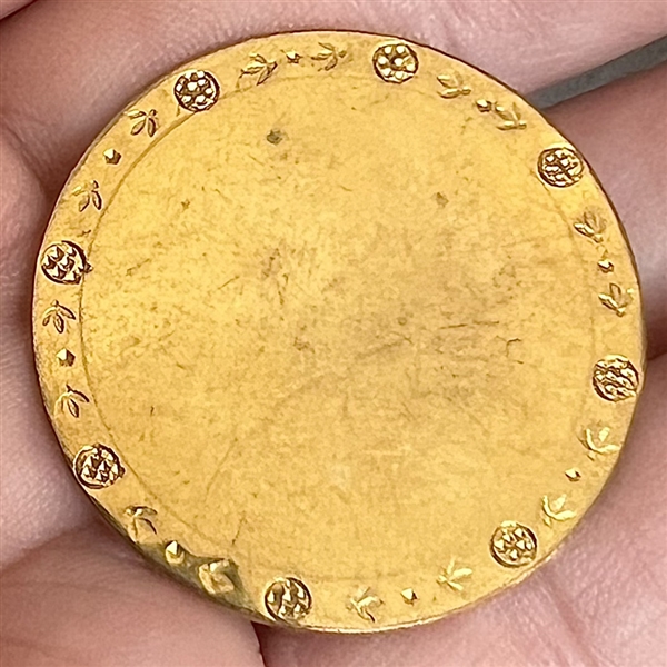 An 18th c. Copper Colonial button with chased border. 