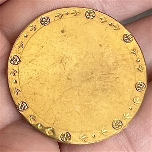 An 18th c. Copper Colonial button with chased border. 