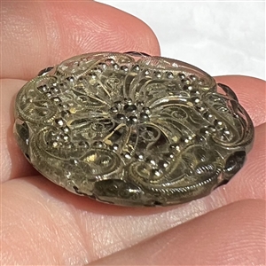 A 19th c. Lacy glass button of lovely paisley design. 