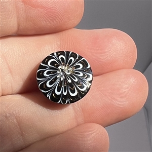 A 19th c. Black glass “Nailsea button. 