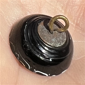 A 19th c. Black glass “Nailsea button. 
