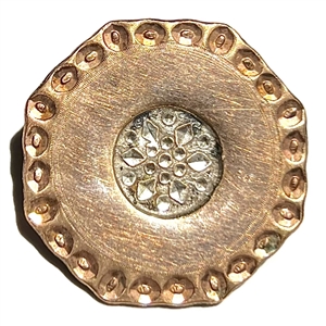 An 18th c. Copper Colonial button in a hexagon shape with chased border. 