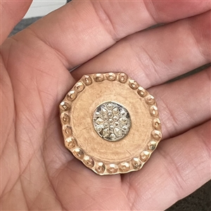 An 18th c. Copper Colonial button in a hexagon shape with chased border. 