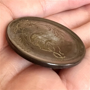 A 19th c. Incised pearl button of plant life. 