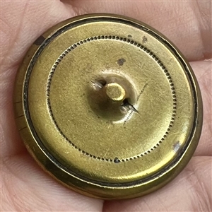 A 19th c. pearl button set metal with garland.